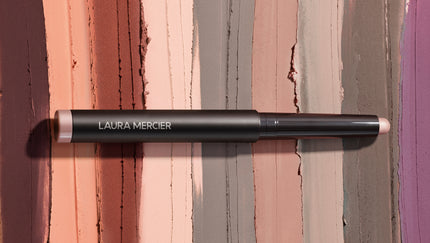 Laura Mercier Caviar Stick Eye Shadow on a striped background