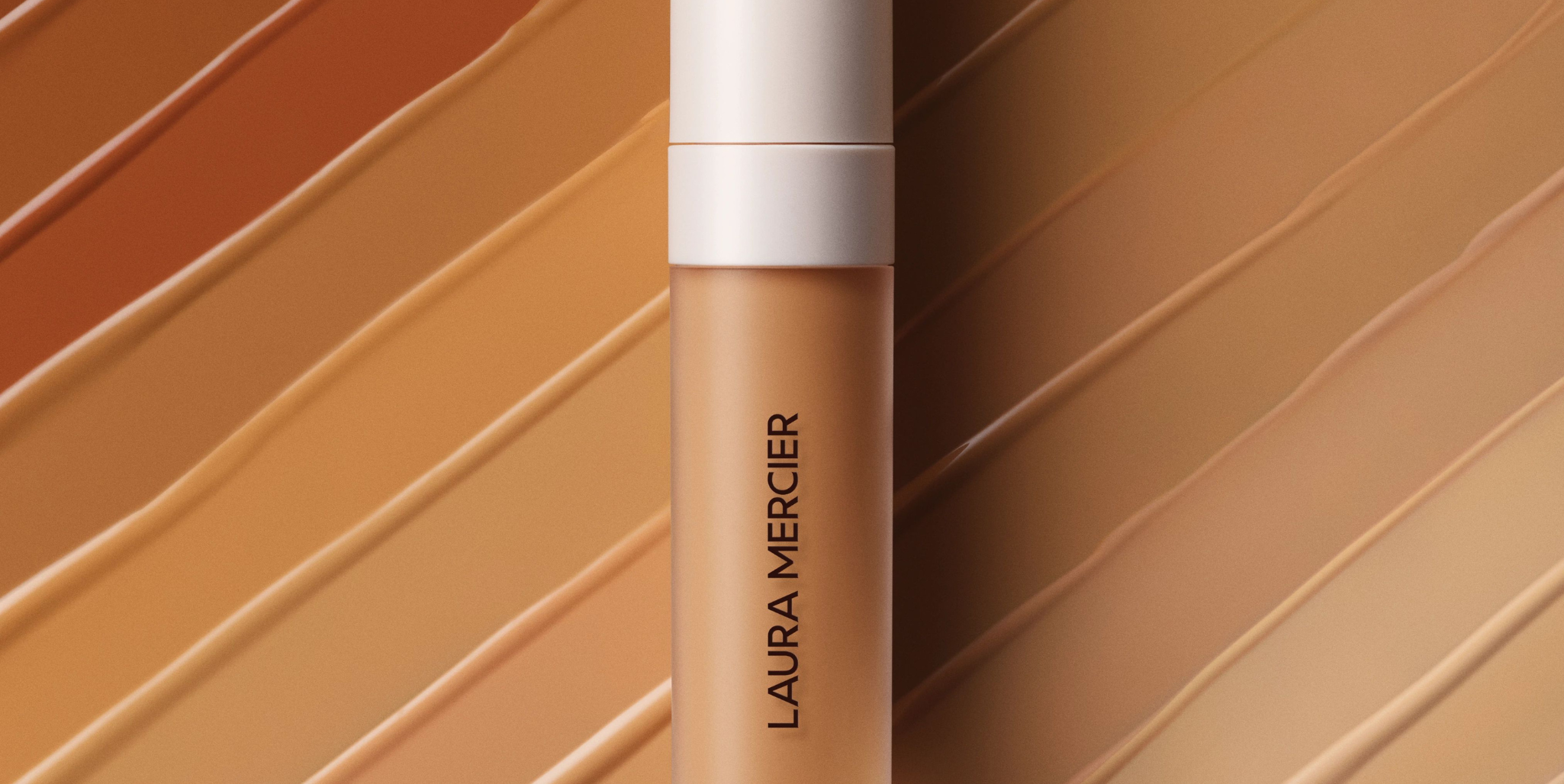Close up image of Real Flawless Concealer with a background of concealer swatches
