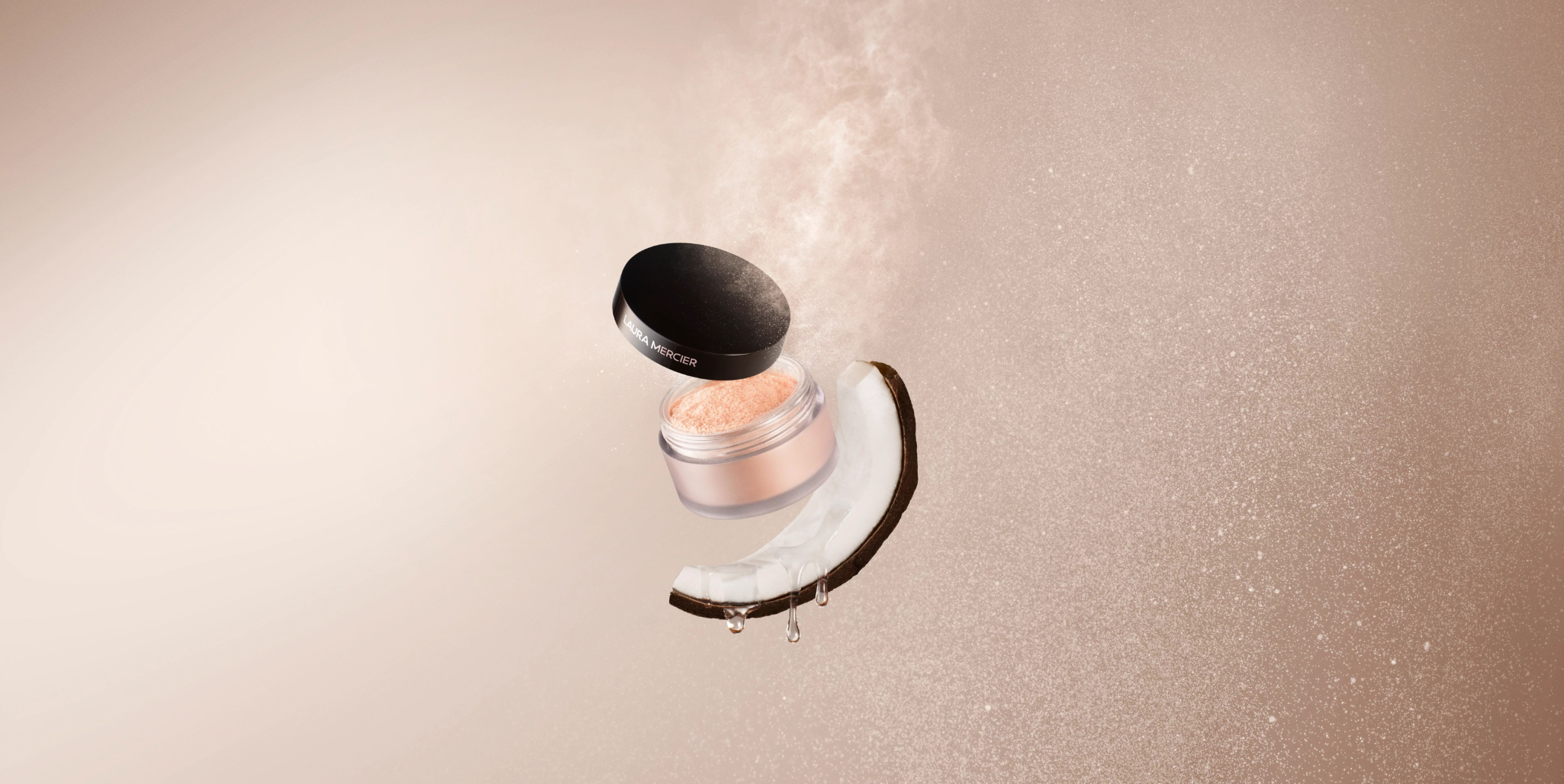 Laura Mercier Sceret Brightening Color Correcting Under Eye Powder on top of a half slice of coconut