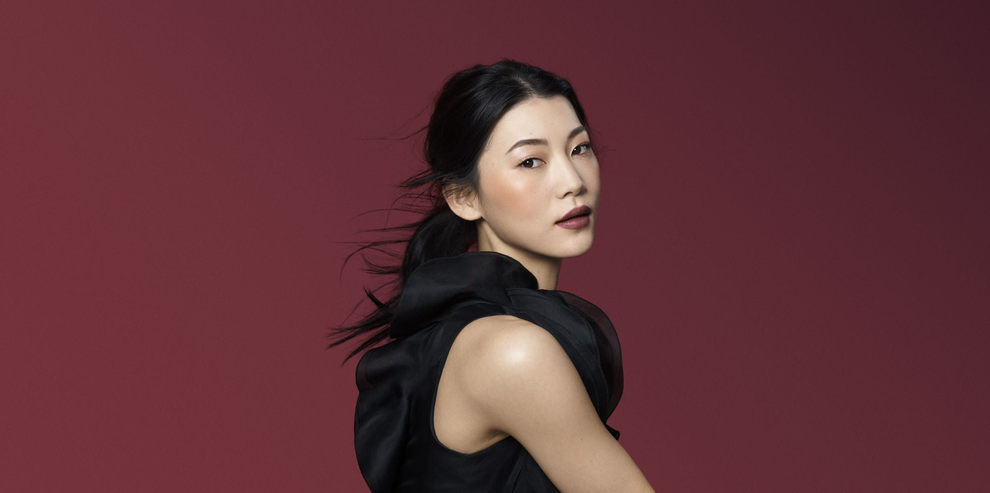 Model with bold lipstick and neutral look