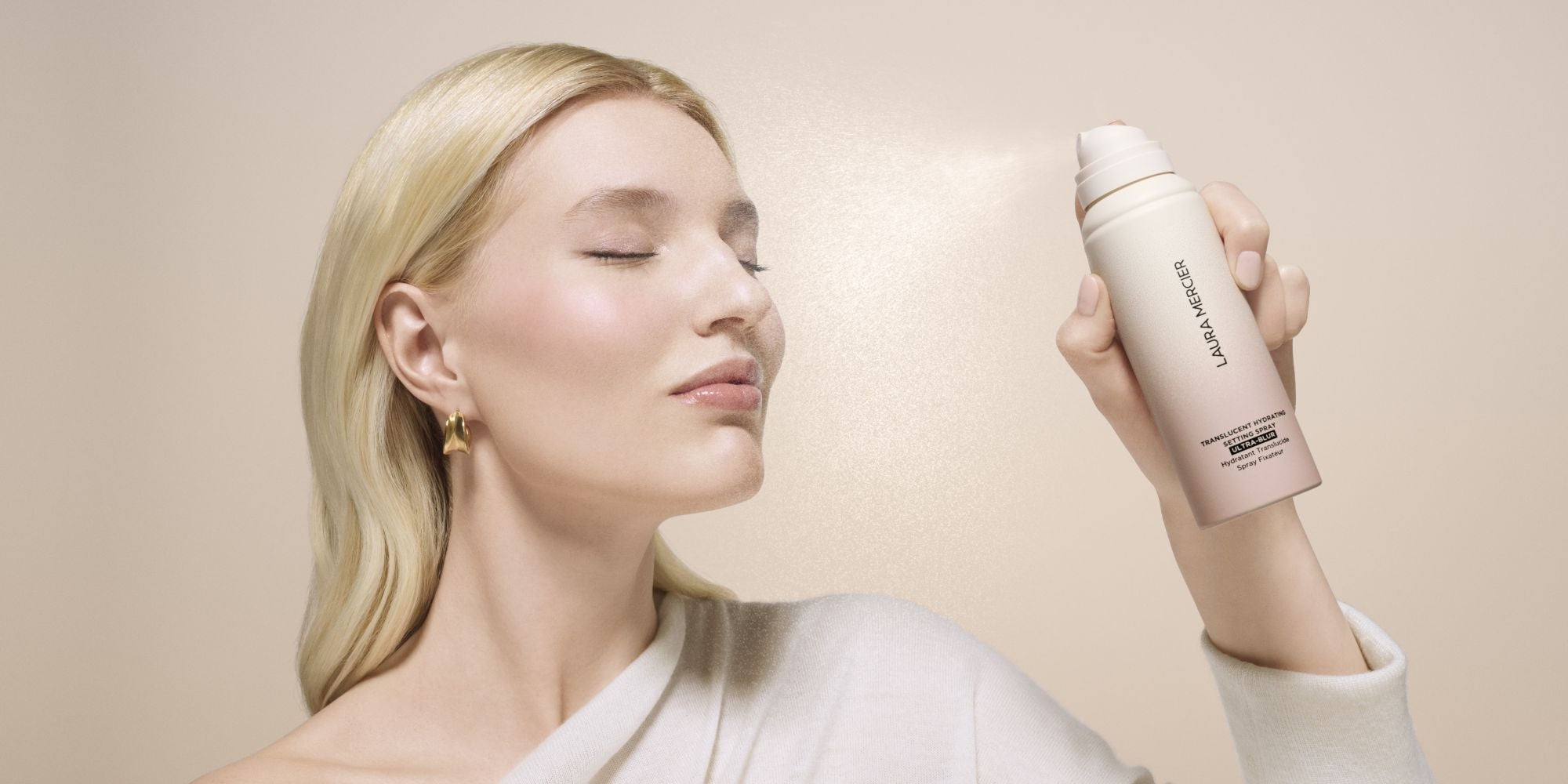 Model applyingTranslucent Hydrating Setting Spray Ultra-Blur