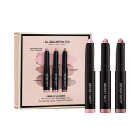 Laura Mercier makeup set with three eye shadow sticks and a box on a transparent background