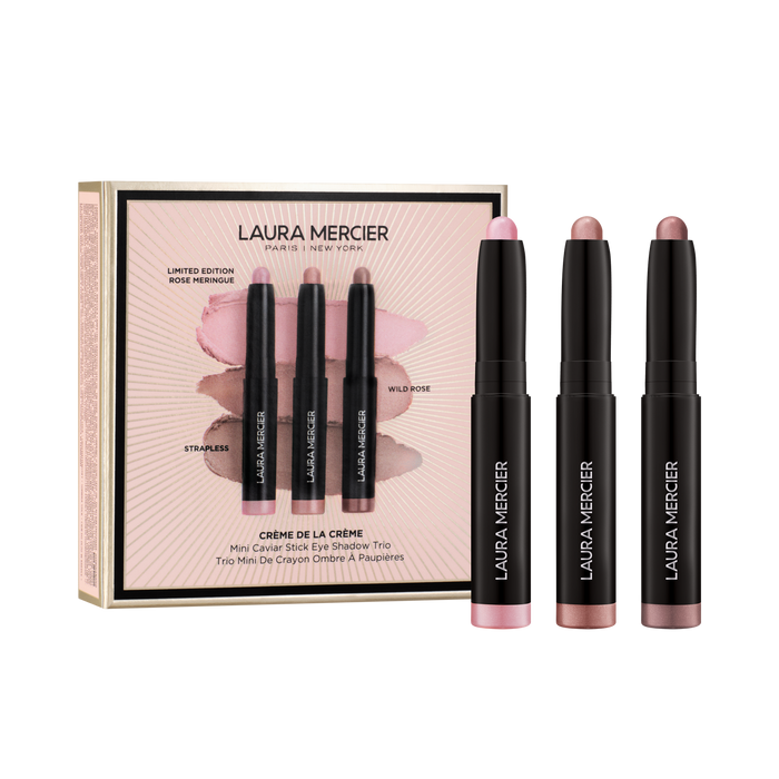 Laura Mercier makeup set with three eye shadow sticks and a box on a transparent background